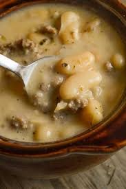 Tuscan Sausage And White Bean Soup Is A Hearty Flavorful Dish Perfect For Dinner Any Night Easy Soup Recipes Vegetarian Soup Recipes Soup Recipes Slow Cooker