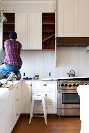 Appliances such as refrigerators, dishwashers, and ovens are often integrated into kitchen cabinetry. Farmhouse Kitchen Adding A Shelf Below Our Upper Cabinets Other Layouts We Considered The Grit And Polish