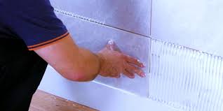 Totally renovated bathroom with shower cabin and bathtub,light cream coloured tiles on floor and wall. What Is The Best Adhesive For Wall Tile