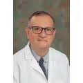 Dr. Carlos A. Mora, MD
