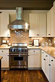 Farmhouse Kitchen With Brick Backsplash And Wood Floors Brick Backsplash Kitchen Country Kitchen Backsplash Farmhouse Style Kitchen
