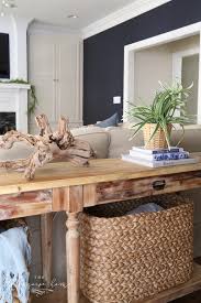 These art ledges, filled with frames, disappear behind the pink sofa and go down to the floor, as captured by annika von holdt. How To Style A Console Table Behind A Couch 4 Ways The Turquoise Home