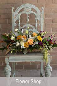 With orange roses, purple stock, and two colors of larkspur, these vibrant colors dance in an arrangement that brings a smile to all who see it! The Fresh Flower Market Aurora Co Fresh Flowers Delivered
