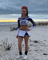SeniorSunday 💙🖤 Meet Kaitlyn Healy from @ece_ladyjade. This is her 2nd  year at ECE and her 9th year cheering. She is graduating from East  Bridgewater High School. After graduation, Kaitlyn plans on