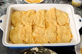Perfect for cinco de mayo or just look at that ooey, gooey, cheesy goodness! Green Chile Chicken Enchilada Casserole Bake For An Easy Dinner Everyone Will Love