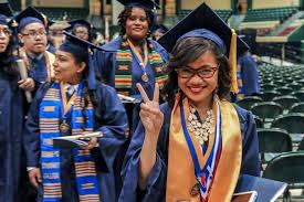 Prince George S Community College Grads In The Background Wearing School Pride And Pan African Colors Stoles By Gra African Colors Summer Photos School Pride