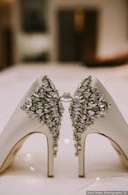 Glam Wedding Shoe Inspo Jeweled Heel White Heels Displaying Wedding Ring Serj Ortan Photography Bridal Wedding Shoes Designer Wedding Shoes Wedding