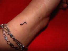 Black music note tattoo on wrist. Music Note Finger Tattoos Tattoos Music Notes Tattoo