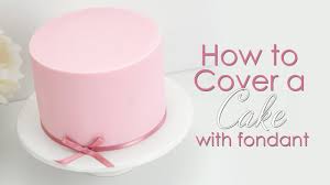 How do you make easy fondant icing? How To Prepare Cover A Cake With Icing Fondant Youtube
