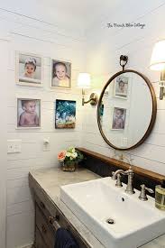 The color palette is neutral, with wood tones, gray white and a touch of blue. A Coastal Farmhouse Bathroom Remodel French Blue Cottage