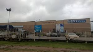 People standing around are perplexed as the fire billows from the centre of the supermarkets. Next Cash And Carry Thepicloc