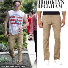 Brooklyn beckham, with camera, in the front row for the burberry january 2016 show in london. Brooklyn Beckham In Khaki Chinos And Bruce Springsteen Tour T Shirt