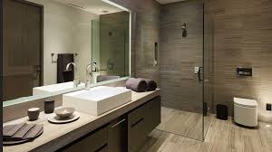 To achieve the hotel look, use a medium to dark tile on the floor and run that same tile up one or two feature walls to provide interest, with the rest of the walls remaining in standard white. 10 Space Saving Bathroom Design Ideas For Your Home