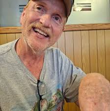 Young boy wins fishing derby with a big trout at mountain top