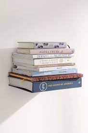 This helped to soften the big poster into all the books. 21 Decorating Ideas Every Bookworm Will Love Wall Bookshelves Invisible Bookshelf Book Wall