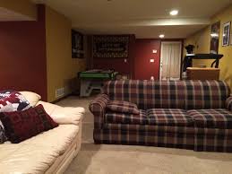 The cozy room incorporates a large sectional couch and a tv area, updated overhead lighting and new floors, which were lowered during the renovation to provide the homeowners with more headroom. 75 Beautiful Brown Basement With Red Walls Pictures Ideas July 2021 Houzz