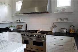 This is an incredible current case of a white kitchen, including a light cream mosaic backsplash. White Kitchen Cabinets With Black Countertops Contemporary Kitchen Pink Wallpaper Tile Countertops Kitchen Countertops Black Countertops