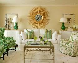 I Chose This Picture Because It Has A Strong Focal Point With The Sun On The Wall And Good Visual Hierarchy With In 2020 Gold Living Room Living Room Green Green Rooms