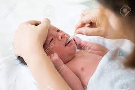 Asian Newborn Baby Cleaning Tongue Cheek Bulge And Mouth After Stock Photo Picture And Royalty Free Image Image 92741777