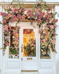 Flowers On The Facade Of A Flower Shop In London S Belgravia Click Through For More Pictures On A Flower Shop Display Flower Shop Design Flower Shop Interiors