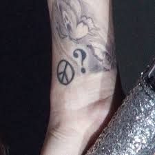 Many people also get this tattoo to connect with god and reflect their religious teachings into their daily lives. Cher Lloyd Peace Sign Question Mark Wrist Tattoo Steal Her Style