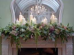 Dec 11, 2019 · from quaint chapels in the countryside to towering catholic cathedrals, church wedding decor is an elegant way to reflect your wedding theme. Fully Decorated Mantle With Floral Arrangement With Pillar Candles Placed Thorough O Christmas Flower Arrangements Wedding Flower Decorations Christmas Flowers