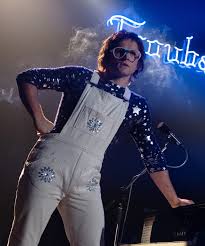 Rocketman also stars jamie bell as elton's longtime lyricist and writing partner bernie taupin, richard madden as elton's first manager, john reid, and bryce dallas howard as elton's. Sparkle This Halloween With These Rocketman Inspired Costumes Elton John Costume Elton John Rocketman Movie