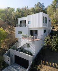 stack house by freelandbuck is lodged into steep hillside in la house built into hillside hillside house building a house