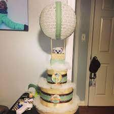 Hot Air Balloon Diaper Cake On Top Of A Hatbox By Brittanystarzak Hot Air Balloon Diaper Cake Diaper Cake Balloons