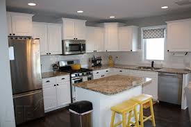 Lemon yellow accents bring life and vibrancy to this chocolate brown and white bedroom. White And Grey Kitchen With Yellow Accents Traditional Kitchen Other