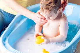 Make your own diy duck waterer. Mother Washing Little Boy In A Blue Bath The Child Is Bathing With A Yellow Duck Hygiene And Water Treatment At Home With The Baby Stock Photo Picture And Royalty Free Image