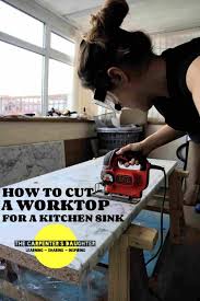 a kitchen sink in a laminate worktop