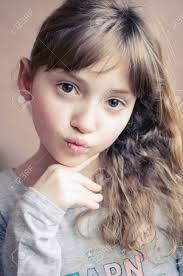 Such a technique is usually chosen by women with dark hair, as it can perfectly spice up the hair at midway with a matching color. Portrait Of Little Pretty Girl Make An Air Kiss Beautiful Girl With Long Dark Blonde Hair And Wonderful Expressive Brown Eyes Little Lady Schoolgirl 8 Years Old Close Up Stock Photo Picture