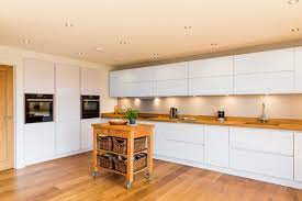 The difference is that it has a greyish or yellowish undertone. Nobilia White High Gloss Kitchen With Solid Wood Worktop Modern Kitchen Hampshire By Eco German Kitchens Houzz