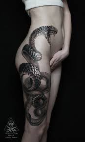 You can have different versions. Scary Snake Thigh Tattoo Amazing Tattoo Ideas