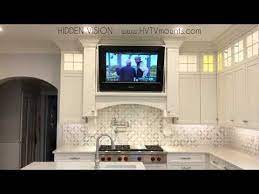 This Hidden Tv Mount Will Make You Want To Put A Tv In Every Room Tv In Kitchen Kitchen Cabinet Layout Studio Kitchen