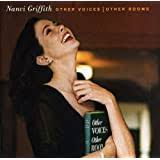 On the front cover she is holding a copy of the kindness of strangers: Nanci Griffith Last Of The True Believers Amazon Com Music