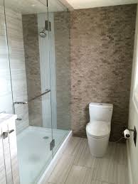 Glass Shower With A Solid Acrylic Base Pan Split Face Slate Accent Wall With Glass Tile Waterfall Effec Shower Base Fiberglass Shower Pan Fiberglass Shower