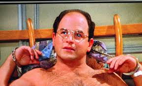 Why did the woman leave her handcuffs behind after robbing George?