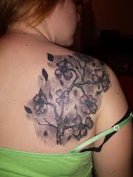 The white color is considered a symbol of purity in western culture, although it is the color of death in many eastern cultures instead. Cool Gray Ink Dogwood Flower Tattoo On Back Tattooimages Biz