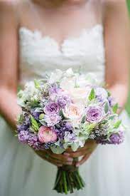Here, the lillipillian added a purple succulent to an arrangement of dahlias, garden roses, and lavender. A Romantic Spring Bridal Bouquet In Purple Pink Chic Vintage Brides