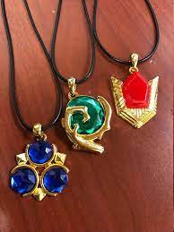 Zelda Spiritual Stones Ocarina Of Time Spiritual Stones Goron S Ruby Kokiri S Emerald Zora S Sapphire Spiritual Stone Necklace In 2021 Legend Of Zelda Breath Ocarina Of Time Legend Of Zelda