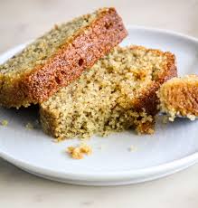 Moist and slight chewy semolina cake also known as sugee cake served with delightful citrus and bay leaves syrup. Orange Semolina Syrup Cake