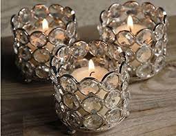 Create a beautiful wedding centerpiece arrangement with a few scattered unscented votives for a warm cozy ambiance. Wholesale Bulk 50 Pcs Lot Glass Crystal Tealight Votive Candle Holders Weddi Candle Holders Wedding Candle Holders Wedding Centerpieces Tealight Candle Holders
