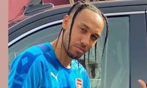 The curtain hairstyle is a cut and style for men where the hair on top is left longer and styled with a middle part to create the appearance of curtains. Arsenal Captain Pierre Emerick Aubameyang Showcases New Travis Scott Inspired Haircut