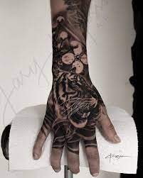 55 Awesome Tiger Tattoo Designs Cuded Tiger Hand Tattoo Hand Tattoos For Guys Full Sleeve Tattoos