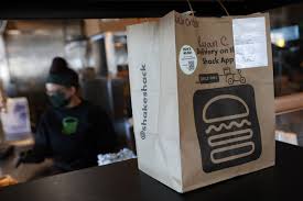 Shake Shack swings to quarterly loss, names new CFO; shares fall 20%