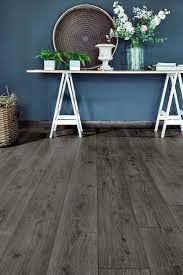 The Blue Walls Of This Hallway Are Set Off Beautifully By The On Trend Dark Grey Tones Of Aqualock 8m Grey Wood Floors Grey Laminate Flooring Dark Oak Flooring