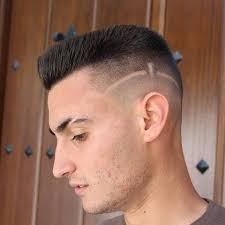 Mohawks are in at the moment and look neat and no-fuss if you incorporate  them into your low fade haircut with trimmed facial hair. Simply style and  go in the mornings!