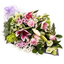 Very beautiful bouquet of the bride on the table. Funeral Tributes Flowers Uxbridge Funeral Tributes Flowers Delivery By Scentsational Flowers